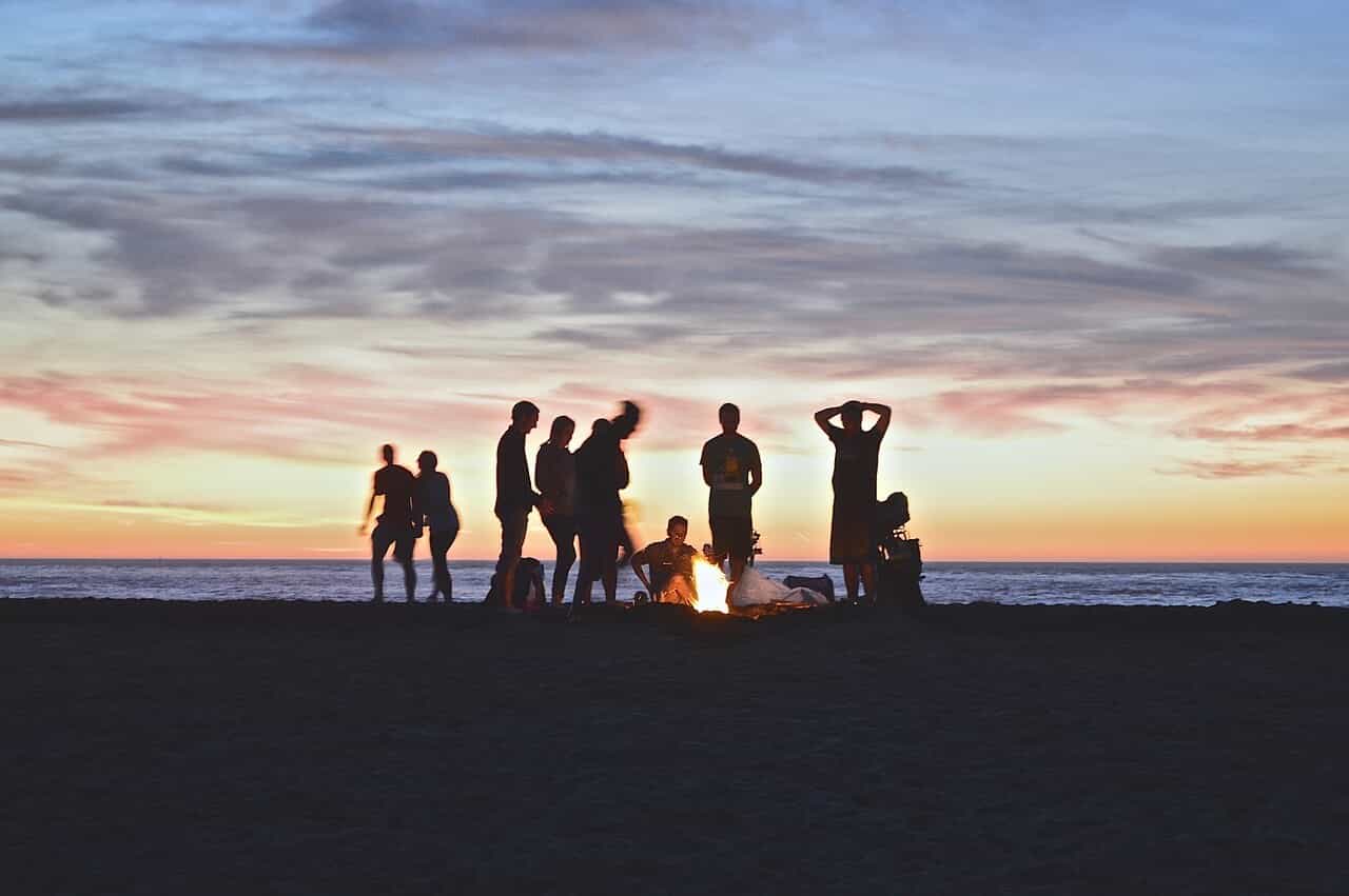 People Enjoying Bonfire at Beach