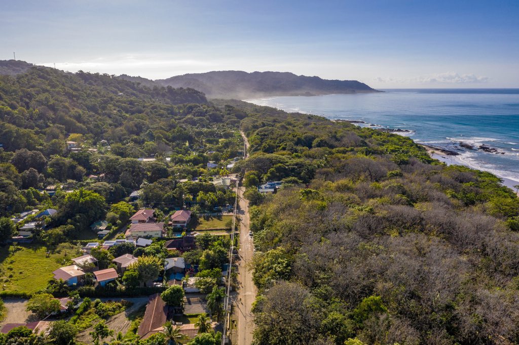 Aerial view of Santa Teresa, Costa Rica’s main road with views of the ocean and hillsides