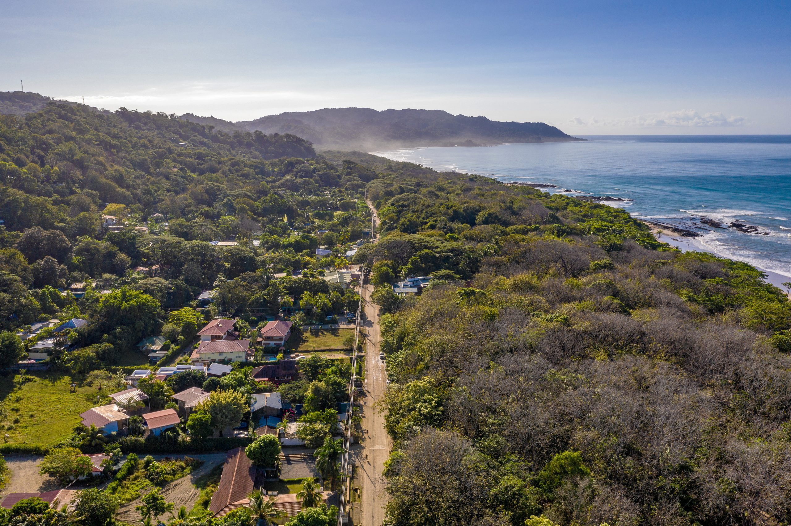 Aerial view of Santa Teresa, Costa Rica’s main road with views of the ocean and hillsides