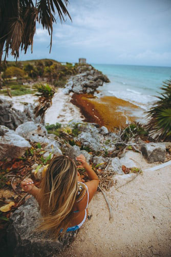 Woman exploring a tropical beach