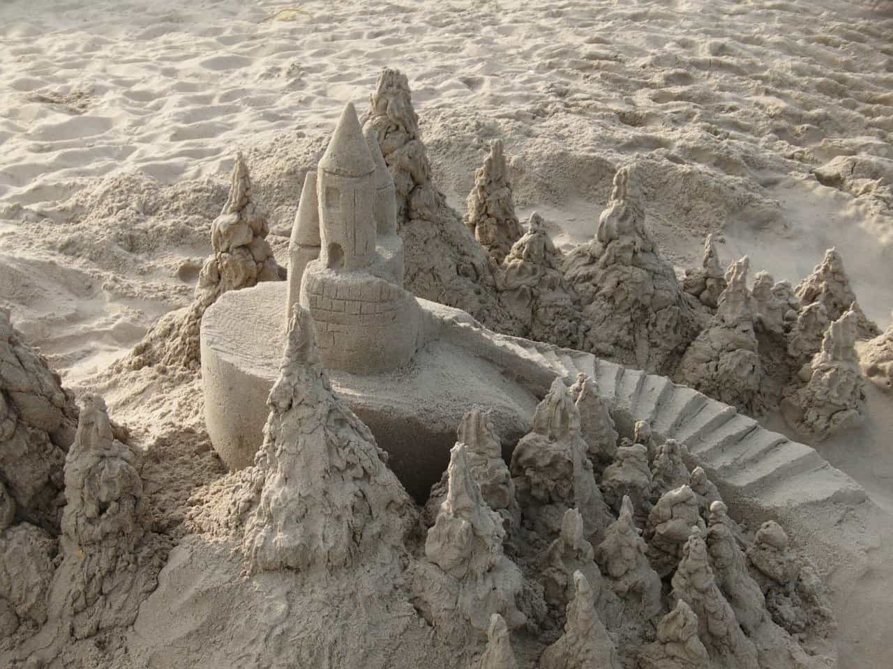 A close-up of a sandcastle on the beach.