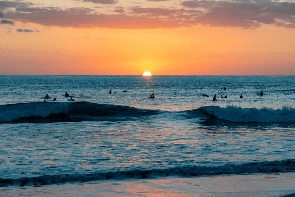 Surfers out at sunset in Santa Teresa, Costa Rica near Casa Teresa Luxury Villas