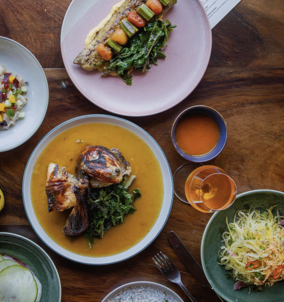 aerial view of several plates of food and drink