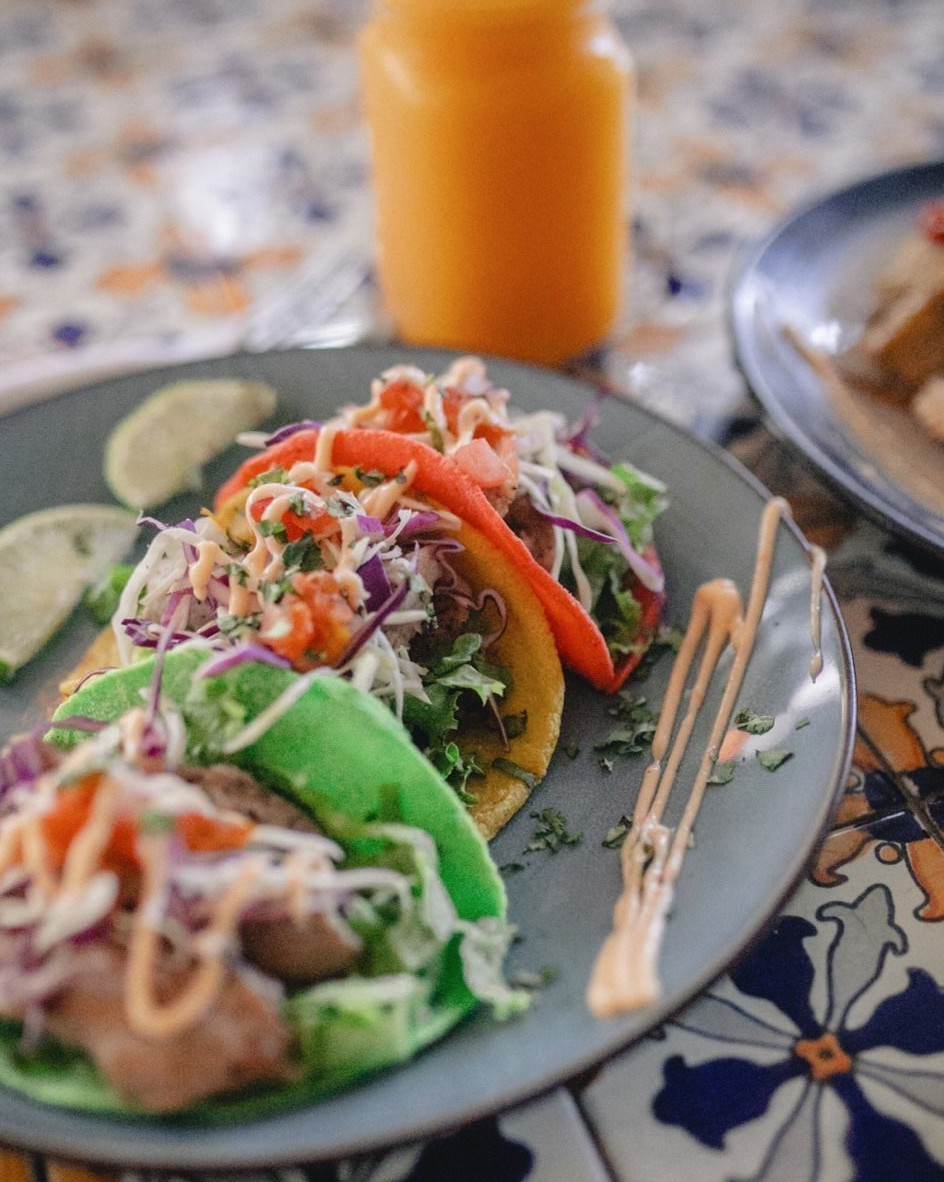 Rainbow tacos, a Costa Rican food, on a plate.