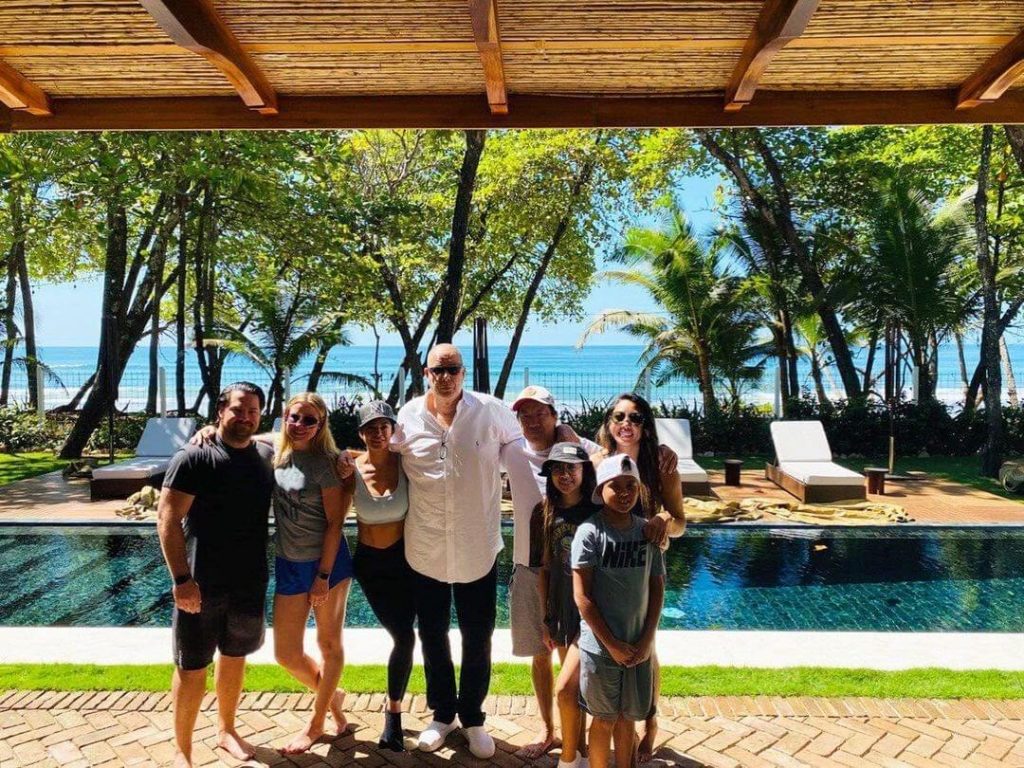 Family posing pool casa teresa luxury villa