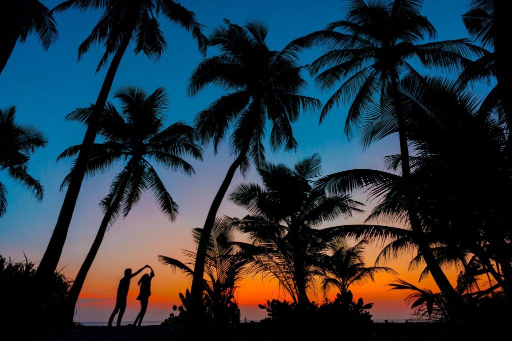 couple enjoying sunset on the beach