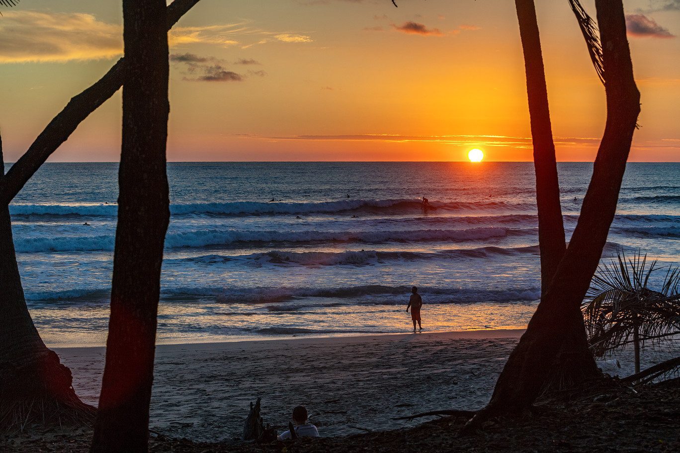 Sunset surfing and lounging on the beach in front of Casa Teresa Luxury Villas in Santa Teresa, Costa Rica