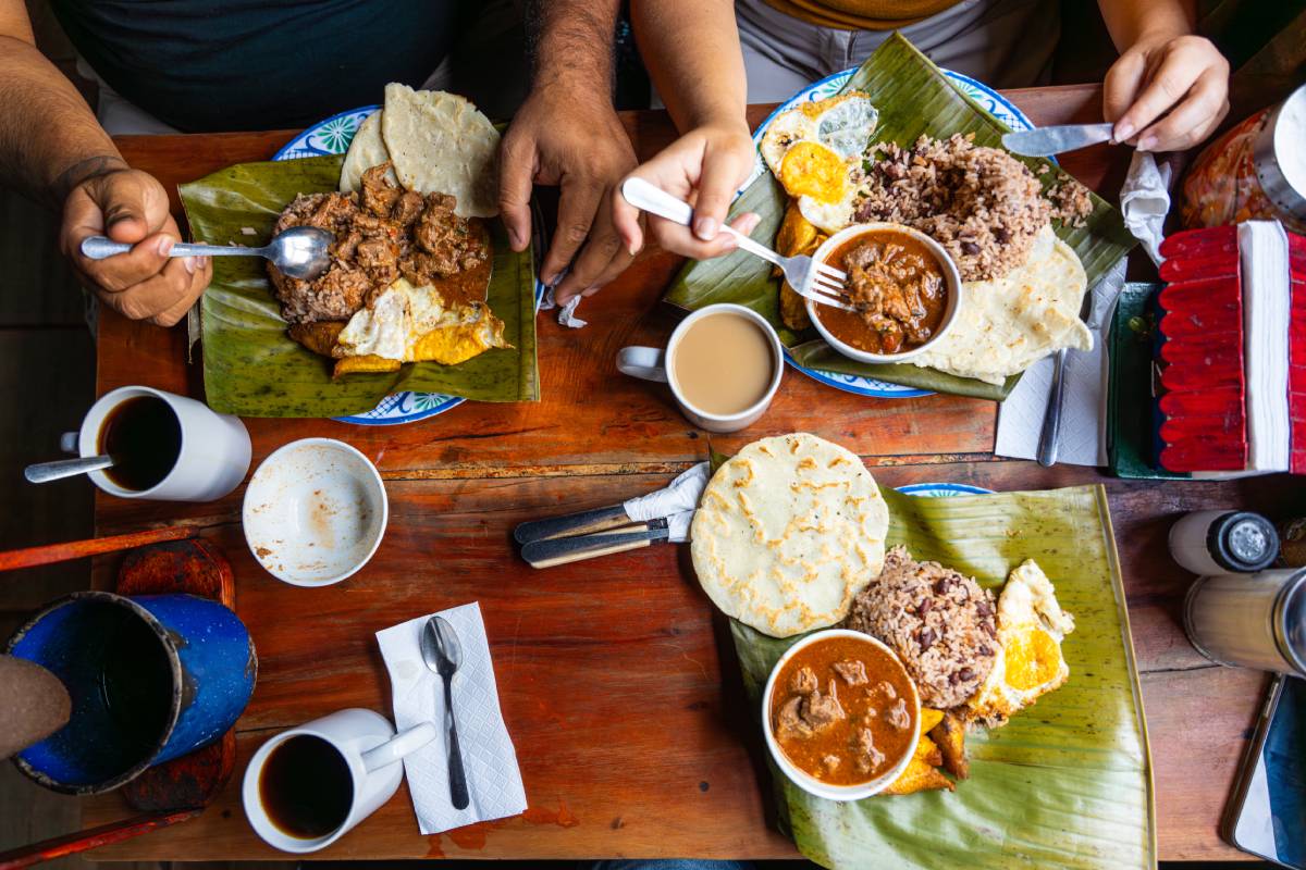 A top-down view of a family enjoying a traditional Central American meal in Costa Rica