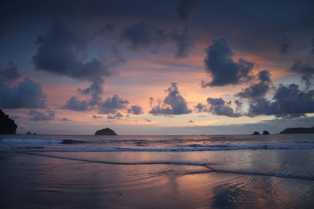 Sunset over a beach in Costa Rica with blue and orange colors