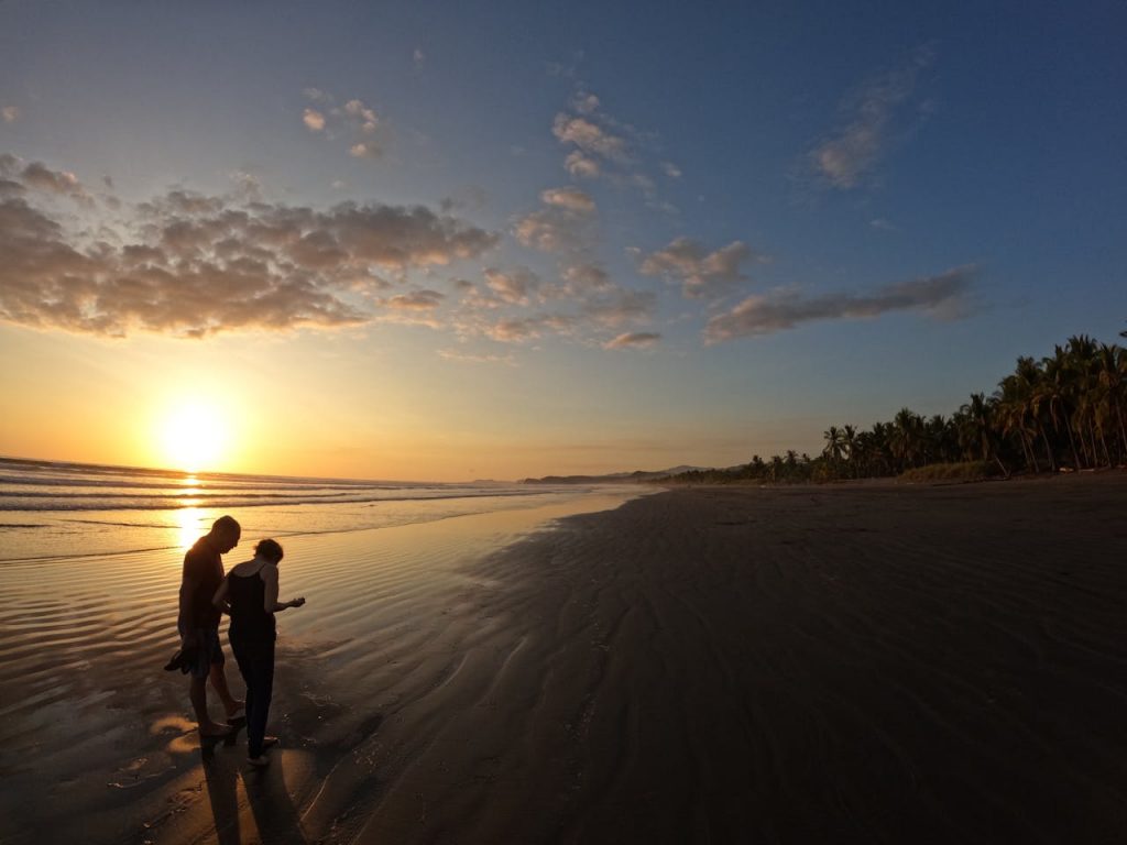 Couple on a sunset stroll on a Costa Rica beach